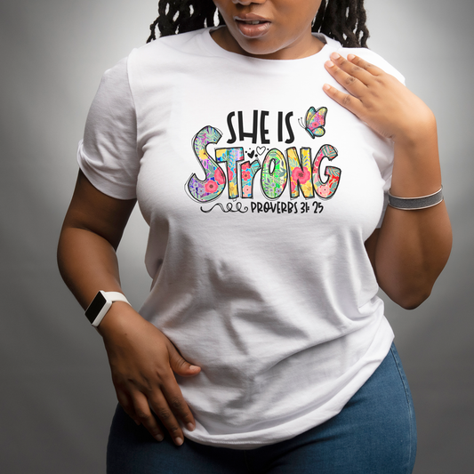 She Is Strong T-Shirt – Proverbs 31:25 Christian Floral Graphic Tee for Women