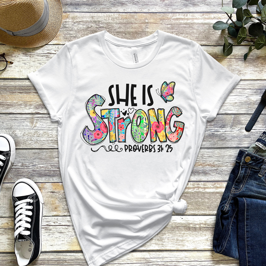 She Is Strong T-Shirt – Proverbs 31:25 Christian Floral Graphic Tee for Women